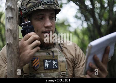 A Ukrainian serviceman of the 3rd separate assault brigade aims a 82mm ...