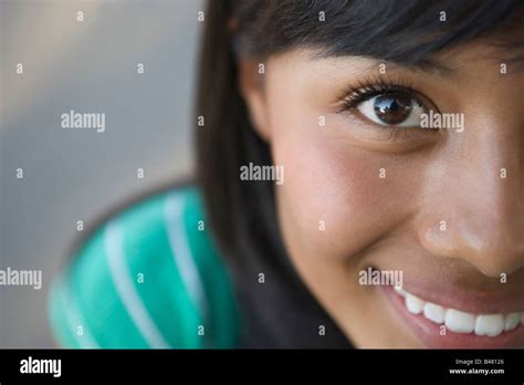 Closeup Of Fifteen Year Old Hispanic Teenager Looking At Camera Girl Woman Latina Latino