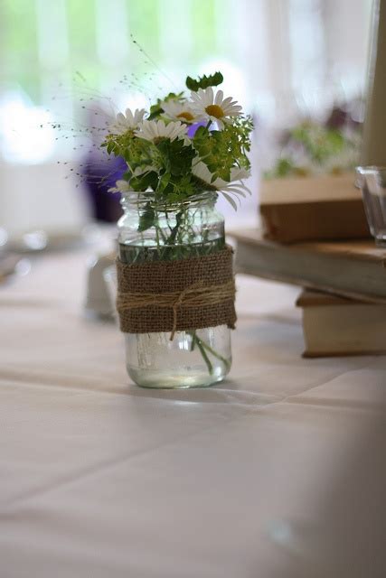 Romantic Floral Design With Hessian Wrapped Jam Jars