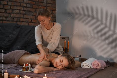 Relax And Enjoy In Spa Salon Getting Massage By Professional Masseur Woman Lying With Naked