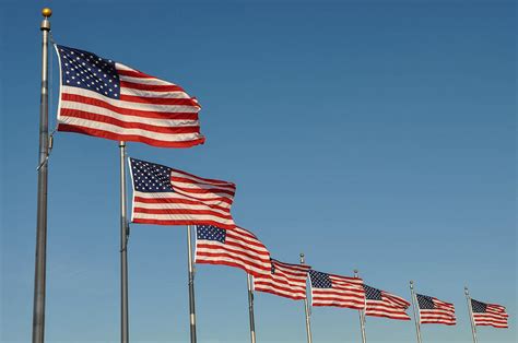 American Flag Waving In The Wind Photograph By Brandon Bourdages