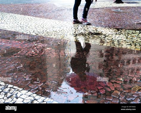 Man Rain Puddle Hi Res Stock Photography And Images Alamy