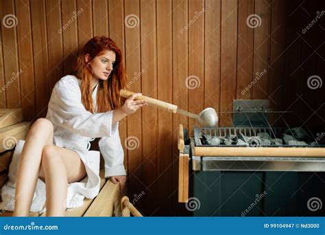 Beautiful Woman In Sauna Pouring Oils On Hot Stones Stock Image Image Of Relax Girl