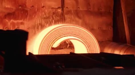 The Red Hot Sheet Of Metal Rotates On The Conveyor Slow Motions Stock Video