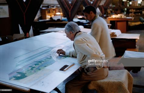 American Architect Frank Lloyd Wright Drafting Beside A Student At