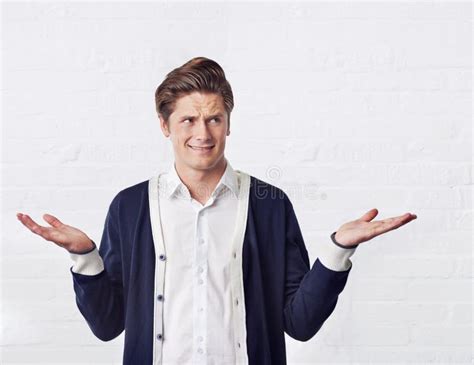 Confused Man Thinking And Why Face In Studio White Background And