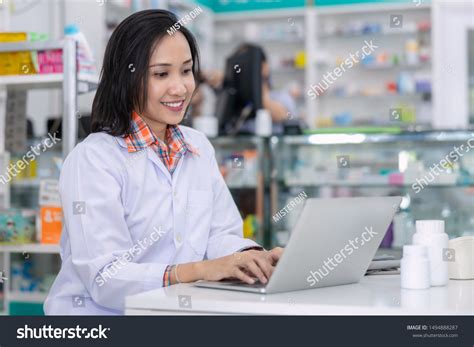 Pharmacist At Computer Over 18934 Royalty Free Licensable Stock