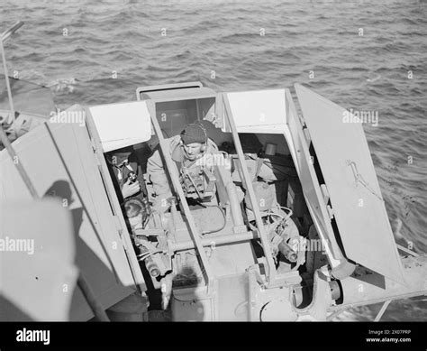 ON BOARD THE CRUISER HMS SUFFOLK ON PATROL. 1941. - In one of the 4 ...