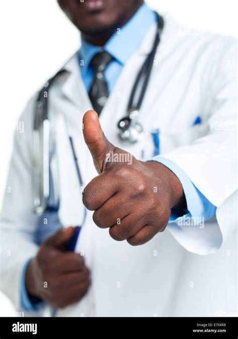 Portrait Of A Smiling Male Doctor Holding A Notepad And Finger Up On