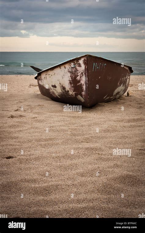 Old Rusty Boat Abandoned On The Beach Cloudy Morning Stock Photo Alamy