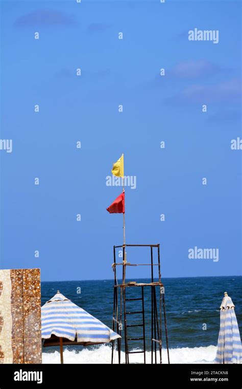 Yellow and red flags on the beach, beach warning flag system, red flag means High risk, rough ...