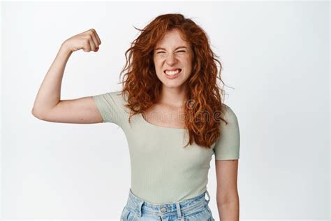 Image Of Sassy Redhead Teenager Flexing Biceps Showing Muscle On Arm