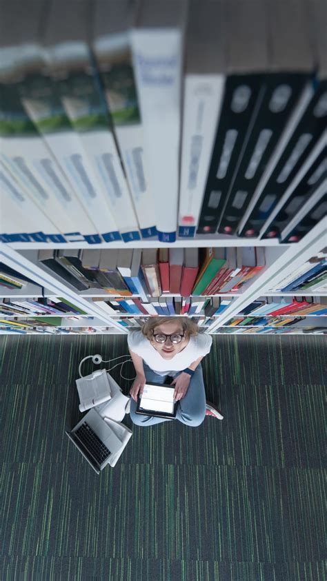 Student in library 11921793 Stock Photo at Vecteezy