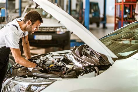 Download Professional Mechanic Working On A Car At Auto Repair Shop