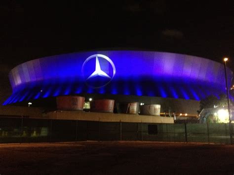 the mercedes benz arena is lit up in blue for its official opening ...