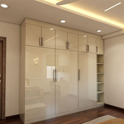 Glossy 3 Door Wardrobe Design With Loft Storage Livspace