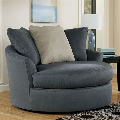 With The Flowing Shaped Arms Surrounding The Pillow Back Design And Supportive Seating Cushions