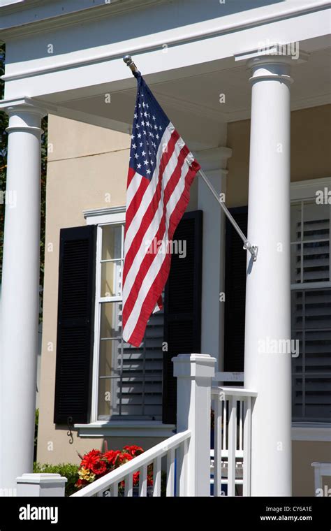 American Flag Flying On The Porch Of An Upmarket House In Florida Usa