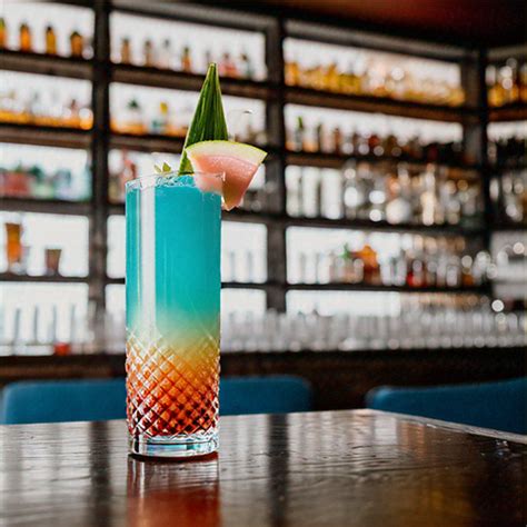 Azure Guava Bliss, Exotic champagne cocktail with guava, mint, and