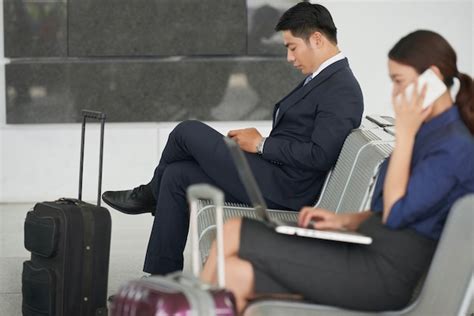 Free Photo Business People In Airports Waiting Area