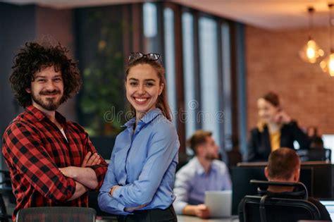Corporate Collaboration European Blonde Businesswoman And Colleague Standing In Modern Office