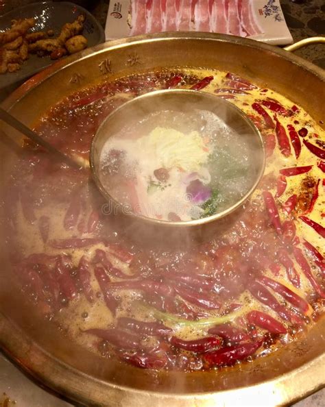 Spicy Hot Pot Steaming With Red Pepper Floating In Stock Image Image Of Chili Hands