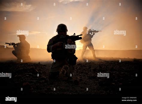 Members Of The Us Navy Seals Train At Sunset At The Navy Special