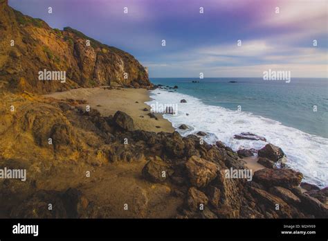 Secluded Pirates Cove Beach At Sunset With A Colorful Sky And Ocean