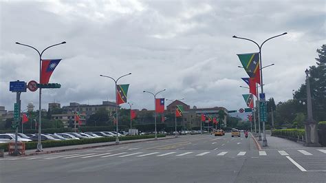 Flags of St. Kitts and Nevis flying alongside flags of the Republic of