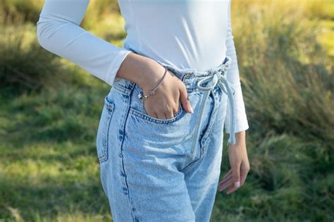 Premium Photo Young Girl In Blue Jeans Lifestyle