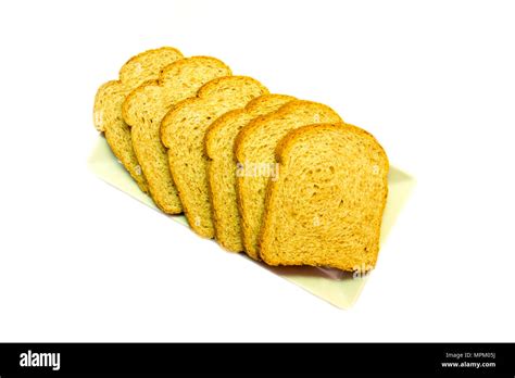 Slices Of Wholemeal Bread On A White Background Viewed From Above Stock