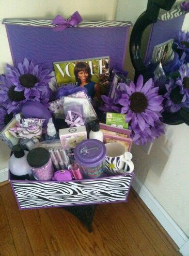 A Purple Gift Box Filled With Lots Of Beauty Products And Flowers Next