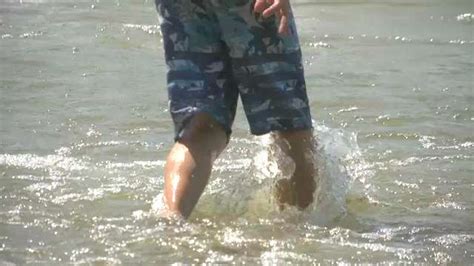 Beachgoers Brave Waves Despite Lakeshore Flood Warning