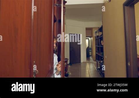 The Naked Woman Is Hiding In The Wardrobe She Goes Out Of The Closet And Runs Away From The