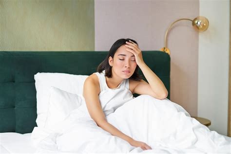 Premium Photo Portrait Of Sad Young Woman Waking Up Feeling Bad Wants To Sleep Wakes Early