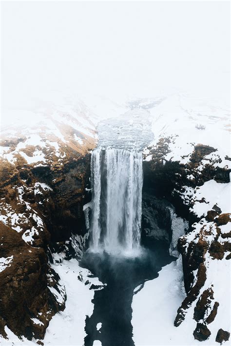 Skogafoss waterfall in the wintertime, Iceland | premium image by rawpixel.com / Luke Stackpoole ...