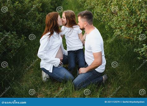 Beautiful Pregnant Brunette Mom And Dad And Dauther In White Clothes