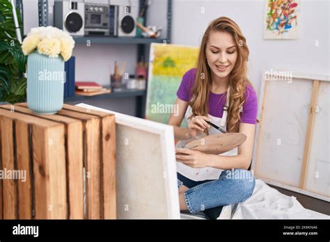 Young blonde woman artist smiling confident drawing at art studio Stock ...