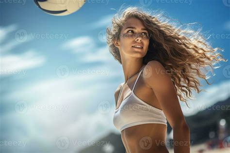 Female beach volleyball players play a volleyball match on the beach ...