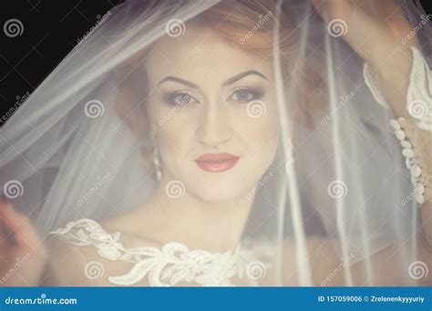 Beautiful Bride Portrait With Veil Over Her Face Wearing Professional