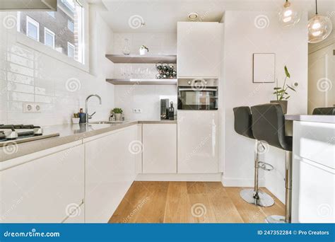 The Interior of a Modern Apartment with a Kitchen Stock Photo - Image ...