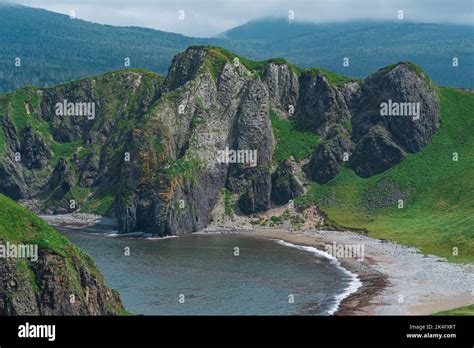 Coastal Landscape Wild Bay With Sandy Beach Between Basalt Rocks Stock