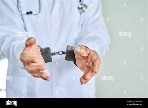 Doctor Handcuffs Hi Res Stock Photography And Images Alamy