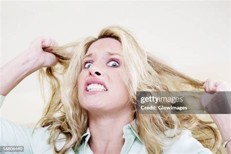 portrait  woman pulling  funny face stock  high res