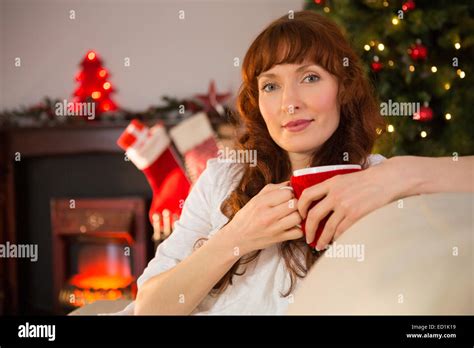 Pretty Redhead Holding A Mug Of Hot Chocolate At Christmas Stock Photo Alamy