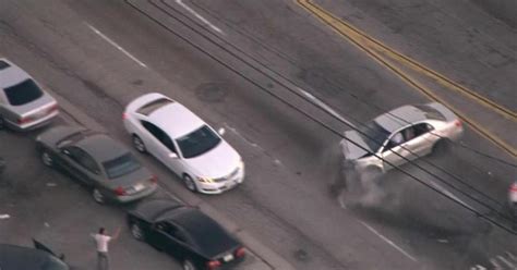 Armed man leads L.A. police on violent car chase - CBS News