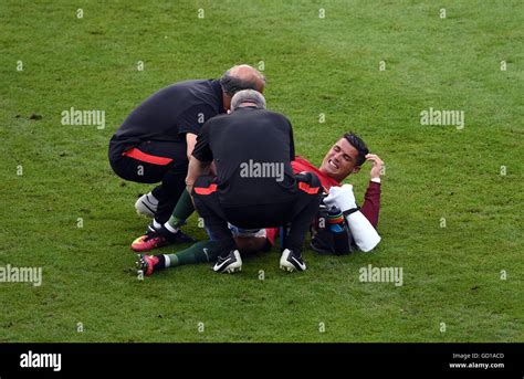 Portugal's Cristiano Ronaldo lies injured during the UEFA Euro 2016 ...