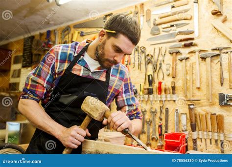 Carpenter With Wood Hammer And Chisel At Workshop Stock Photo Image