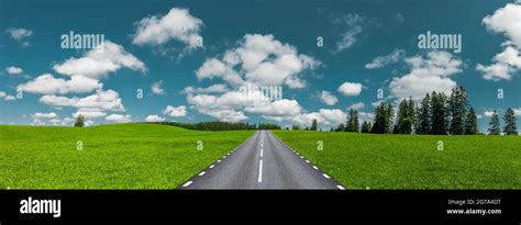 Road Through Green Hilly Landscape Stock Photo Alamy