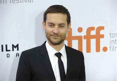 face portrait, adult, standing, tobey maguire, western script